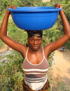 Woman with tub of water